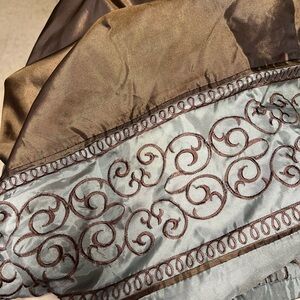 2 curtains, brown and blue 84in length